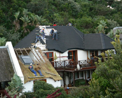 Onduvilla being fitted to thatched roof